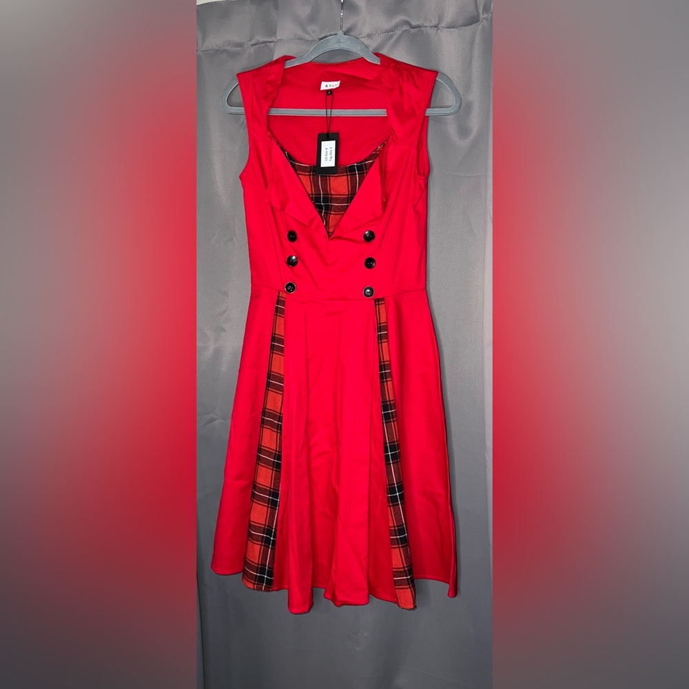 Never been worn, with tags. Red, size 4, flannel style, buttons
